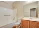 Well-maintained bathroom with a tub-shower combination and a wood vanity at 2445 Sturrock Dr, Henderson, NV 89044