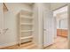 Walk-in closet with built-in shelving, and access to the ensuite bathroom at 2445 Sturrock Dr, Henderson, NV 89044