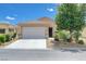 Charming single-story home featuring a two-car garage and low-maintenance desert landscaping at 2445 Sturrock Dr, Henderson, NV 89044