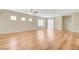 Spacious, open living room with wood-look floors, natural light, and neutral paint at 2445 Sturrock Dr, Henderson, NV 89044