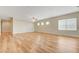 Expansive living room with wood-look floors and several windows for natural light at 2445 Sturrock Dr, Henderson, NV 89044