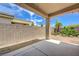 Covered patio and block wall in backyard with clear blue sky overhead at 2445 Sturrock Dr, Henderson, NV 89044