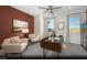 Comfortable office space featuring a modern desk, seating area, and large windows for ample natural light at 2607 Regency Cove Ct # Lot 11, Las Vegas, NV 89121