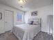 Cozy bedroom featuring a large window and a comfortable full-sized bed at 2732 Dune Cove Rd, Las Vegas, NV 89117