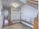 Welcoming entryway with hardwood floors, bench seating, and convenient closet space at 2732 Dune Cove Rd, Las Vegas, NV 89117