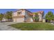 Charming two-story home with a two-car garage, well-maintained lawn, and desert landscaping at 2732 Dune Cove Rd, Las Vegas, NV 89117