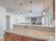 Open concept kitchen with granite countertops overlooking the living room at 2732 Dune Cove Rd, Las Vegas, NV 89117