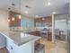 Modern kitchen with granite countertops, stainless steel appliances, and wood cabinets, perfect for culinary enthusiasts at 2732 Dune Cove Rd, Las Vegas, NV 89117