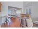 Bright living room with hardwood floors and a cozy sitting area with a view of the dining area at 2732 Dune Cove Rd, Las Vegas, NV 89117