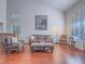 Bright living room with hardwood floors, high ceilings, and large windows at 2732 Dune Cove Rd, Las Vegas, NV 89117