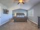 Spacious main bedroom offers neutral paint, vaulted ceilings, and a king-sized bed at 2732 Dune Cove Rd, Las Vegas, NV 89117