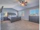 Spacious main bedroom offers neutral paint, vaulted ceilings, and a king-sized bed at 2732 Dune Cove Rd, Las Vegas, NV 89117