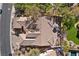 Aerial view showcases tile roof, desert landscape, and outdoor seating area perfect for enjoying the outdoors at 2749 Liberation Dr, Henderson, NV 89044