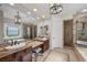 Luxurious bathroom featuring dual sinks, a standalone tub, and a glass enclosed shower at 2749 Liberation Dr, Henderson, NV 89044