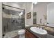 Modern bathroom featuring a glass-enclosed shower and stylish vanity with sleek fixtures at 2749 Liberation Dr, Henderson, NV 89044