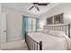 Bright bedroom featuring a queen bed, soft natural light, and neutral decor at 2749 Liberation Dr, Henderson, NV 89044