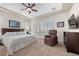 Comfortable bedroom with a queen bed, neutral tones, and plantation shutters at 2749 Liberation Dr, Henderson, NV 89044