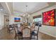 Elegant dining room boasting a decorative chandelier and expansive backyard views at 2749 Liberation Dr, Henderson, NV 89044