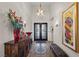 Grand foyer with a high ceiling, ornate chandelier, and stylish decor at 2749 Liberation Dr, Henderson, NV 89044