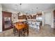 Inviting kitchen with stainless appliances, wine storage, and dining area, ideal for gatherings at 2749 Liberation Dr, Henderson, NV 89044