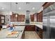 Well-appointed kitchen featuring a large island, stainless steel appliances, and a stylish backsplash at 2749 Liberation Dr, Henderson, NV 89044