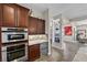 Modern kitchen featuring stainless steel appliances, custom cabinetry, and a convenient layout at 2749 Liberation Dr, Henderson, NV 89044