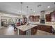 Gourmet kitchen featuring marble countertops, a center island, and seamless flow into the living area at 2749 Liberation Dr, Henderson, NV 89044