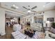 Spacious living room with open layout, neutral decor, and seamless flow into the kitchen and dining areas at 2749 Liberation Dr, Henderson, NV 89044