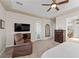 Cozy main bedroom with a walkout to a patio, dresser, and private bath at 2749 Liberation Dr, Henderson, NV 89044