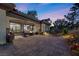 Spacious outdoor patio with comfortable seating, a fire pit, and well-maintained landscaping at 2749 Liberation Dr, Henderson, NV 89044