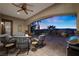 Picturesque outdoor patio at dusk, featuring comfortable seating and a lush landscaped yard at 2749 Liberation Dr, Henderson, NV 89044