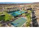 Aerial view featuring community tennis and basketball courts with mature trees and park benches at 2749 Liberation Dr, Henderson, NV 89044