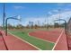 Community basketball court with multiple hoops and colorful surface markings, perfect for recreational play and exercise at 2915 Moulton Crest Ave, Henderson, NV 89044