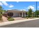 Beautiful one-story home featuring desert landscaping, a paved driveway, and a two-car garage under a sunny sky at 2915 Moulton Crest Ave, Henderson, NV 89044