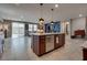 Open concept kitchen with island seating, connecting to a dining and living area at 2915 Moulton Crest Ave, Henderson, NV 89044