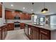 Close-up of kitchen with stainless steel appliances, granite countertops, and modern fixtures at 2915 Moulton Crest Ave, Henderson, NV 89044