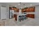 Spacious kitchen featuring a large island, stainless steel appliances, and dark wood cabinetry at 2915 Moulton Crest Ave, Henderson, NV 89044