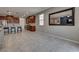 Open floor plan with tile flooring connecting the living room and kitchen area at 2915 Moulton Crest Ave, Henderson, NV 89044