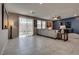Bright, open living room with tile floors and sliding glass doors to the outdoor space at 2915 Moulton Crest Ave, Henderson, NV 89044