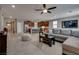 The open-concept living room showcases a modern kitchen and seamlessly connects to the dining area at 2915 Moulton Crest Ave, Henderson, NV 89044