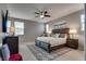Spacious main bedroom with a ceiling fan and ample natural light at 2915 Moulton Crest Ave, Henderson, NV 89044