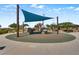 Outdoor playground with shade structure, climbing rocks, slide, and soft landing for enjoyment at 2915 Moulton Crest Ave, Henderson, NV 89044