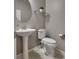 The powder room features a pedestal sink, neutral walls, and a modern toilet for a clean look at 2915 Moulton Crest Ave, Henderson, NV 89044