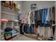 Organized walk-in closet with shelves and hanging rods providing ample storage space for clothes and accessories at 2915 Moulton Crest Ave, Henderson, NV 89044