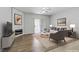 Staged living room featuring modern furniture, fireplace, and sliding glass doors at 2975 Bluegrass Ln # 811, Henderson, NV 89074