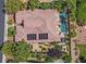 Stunning aerial view of a private backyard featuring a sparkling pool, lush landscaping, and solar panels at 3000 Hammerwood Dr, Las Vegas, NV 89135