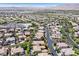 Elevated neighborhood panorama showcasing diverse homes with landscaping and curved roadways at 3000 Hammerwood Dr, Las Vegas, NV 89135