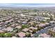 Aerial photograph of a community with varied home styles and neat, green spaces at 3000 Hammerwood Dr, Las Vegas, NV 89135