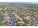 Overhead shot displaying a community with red-tiled roofs and verdant trees interspersed throughout at 3000 Hammerwood Dr, Las Vegas, NV 89135