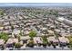Expansive aerial view of a well-planned community with tree-lined streets and meticulously maintained homes at 3000 Hammerwood Dr, Las Vegas, NV 89135